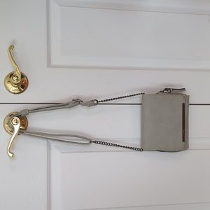 Brand new light grey vegan leather purse with chain. Zipper pocket, card slots